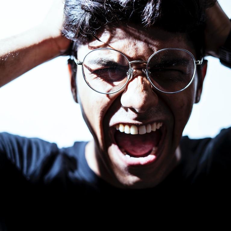 An angry or stressed man screaming